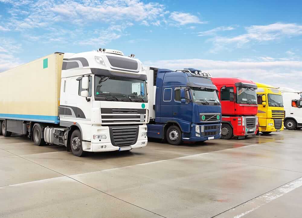 various lorries on parking lot