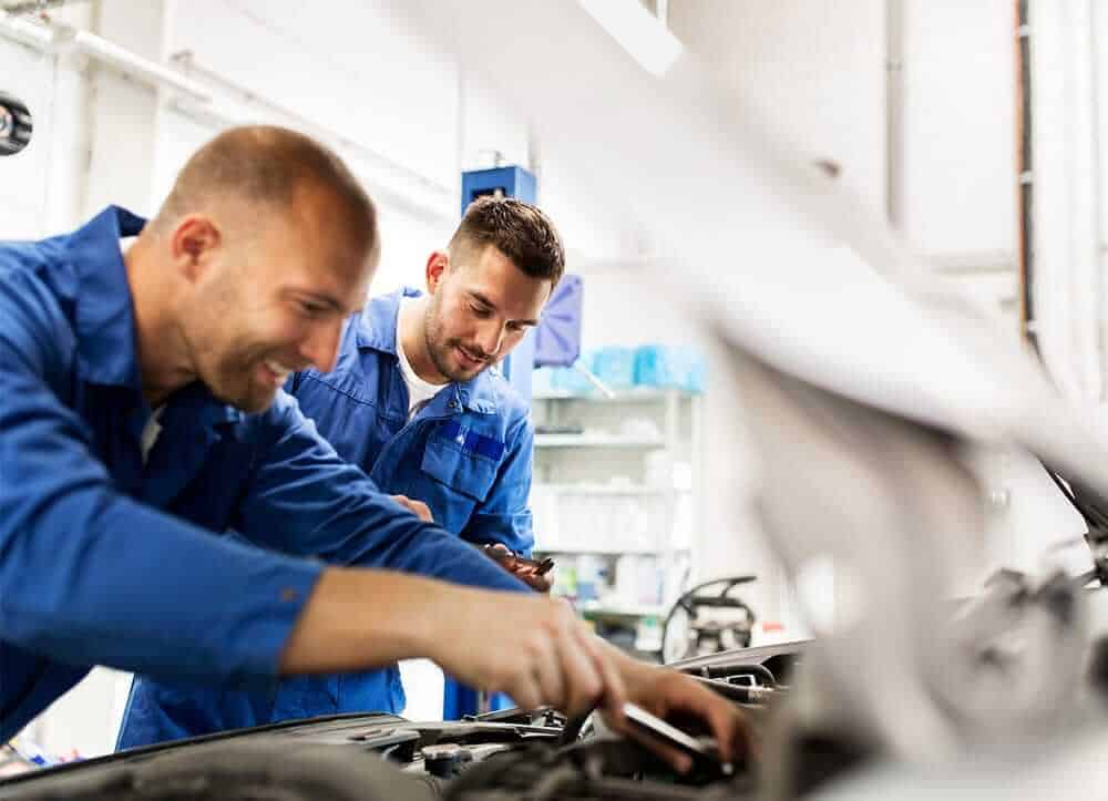 mechanics repairing car