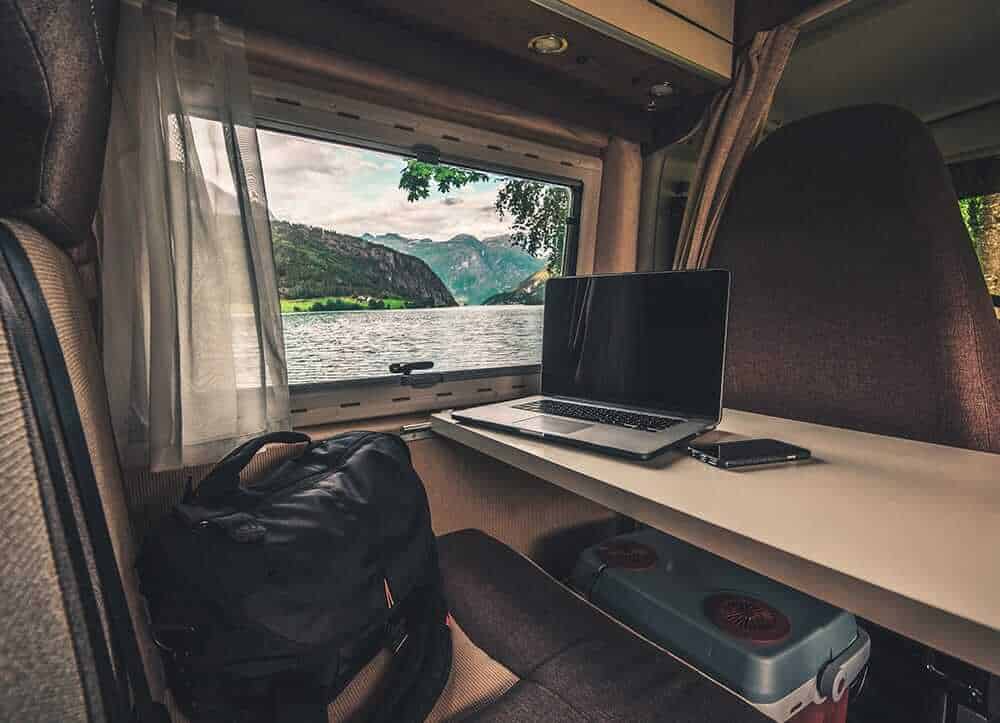 window of motorhome with a view on a lake