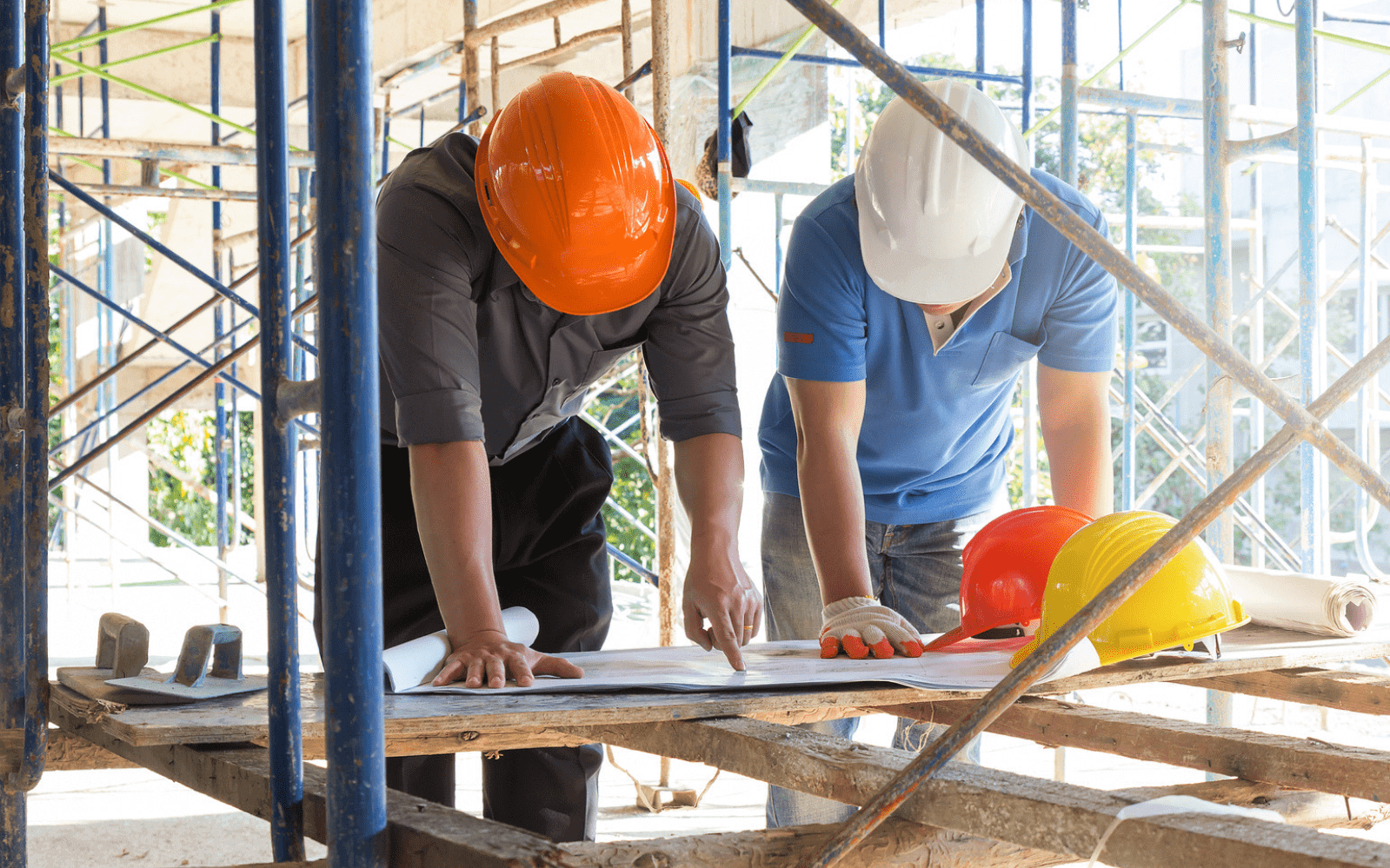 Two men looking at plans