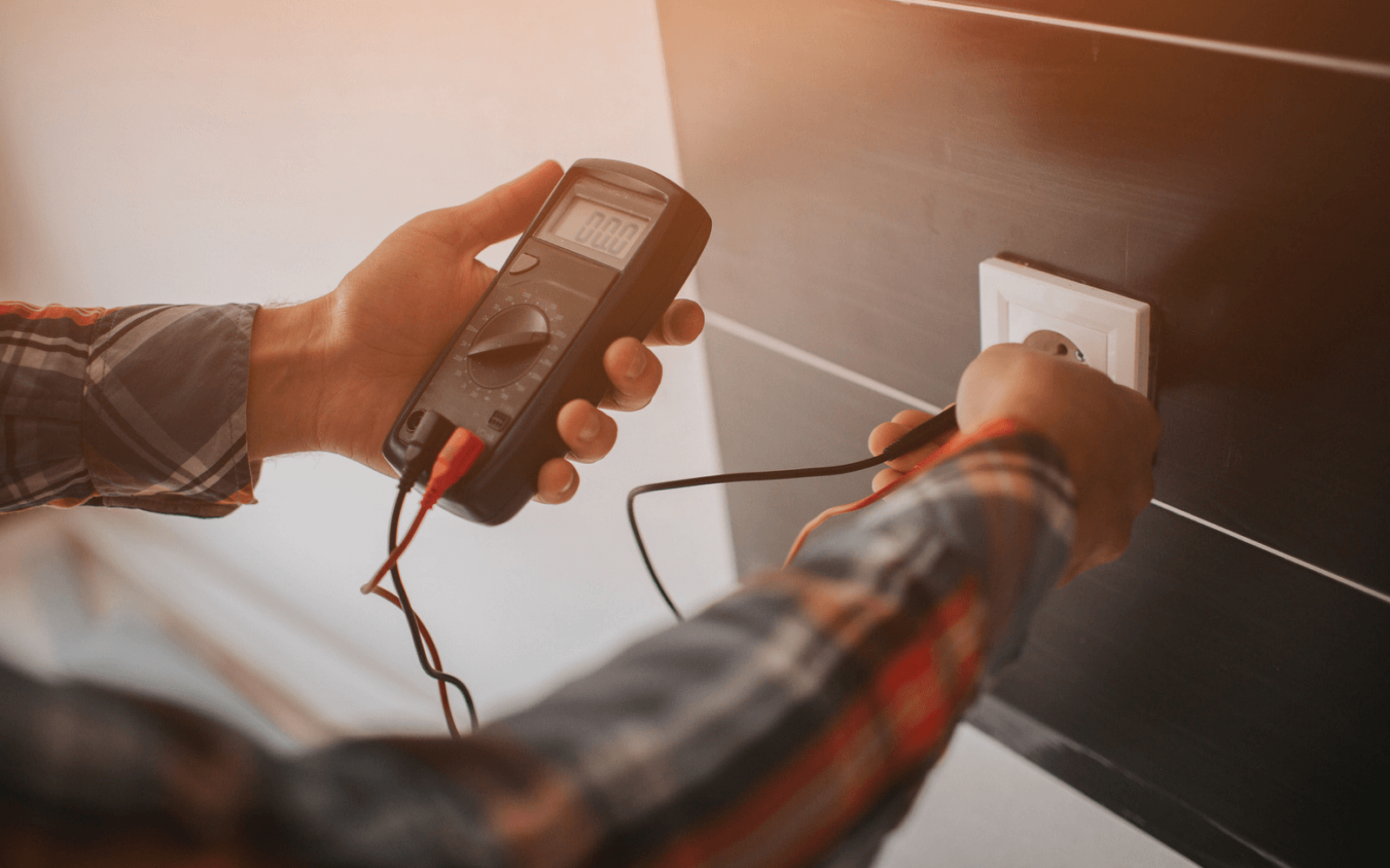 Electrician working on socket