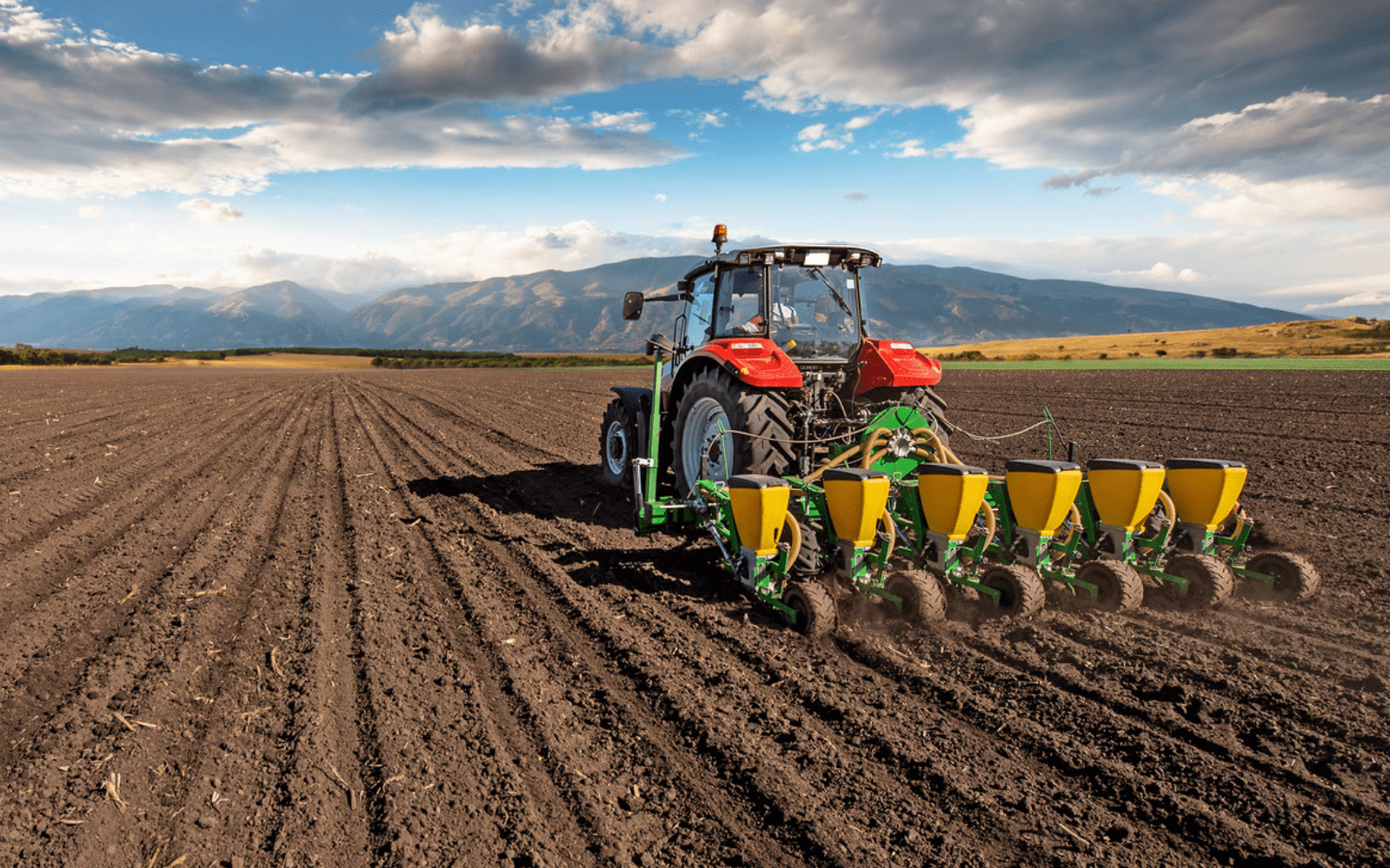 Combine harvester working in field